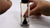 Ferrofluid being moved around in a bottle - Magnetic Fluid