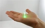 A green laser shining through the Aerogel